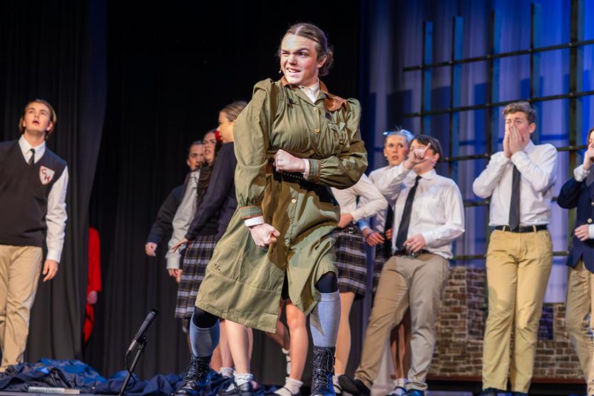 Students perform onstage